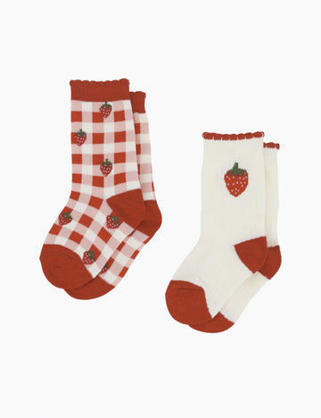 Two pairs of socks with strawberry design on a white background
