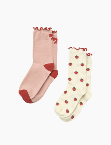 Two pairs of socks, one pink and one cream with strawberry pattern, on a white background.