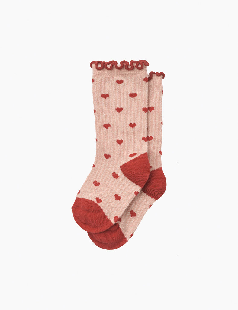 Pink socks with red heart pattern and cuffs on a white background