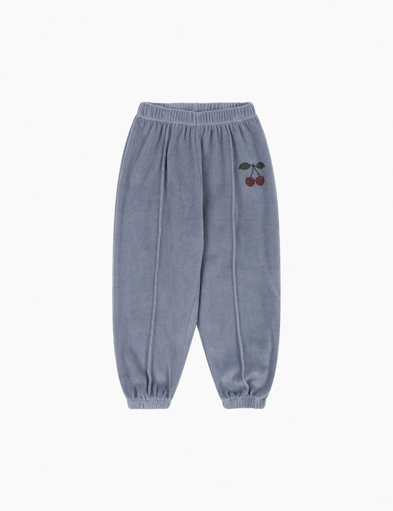 Blue sweatpants with a cherry design on a white background