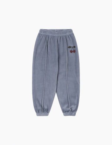 Blue sweatpants with a cherry design on a white background