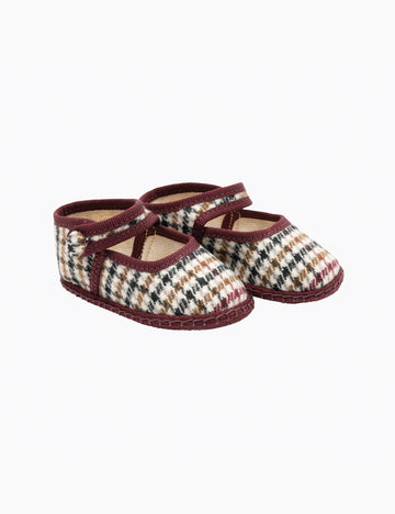 Pair of plaid baby shoes on a white background
