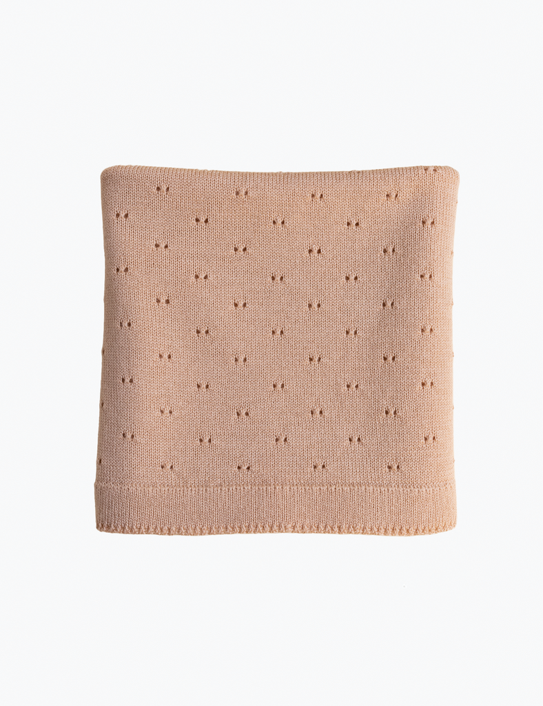 Image of a beige baby blanket.