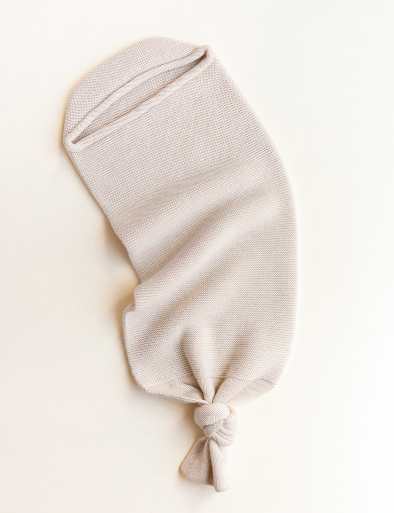 Image of knitted cocoon in cream