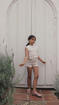 Video of a young girl wearing the Paloma Vest and matching Paloma Shorts